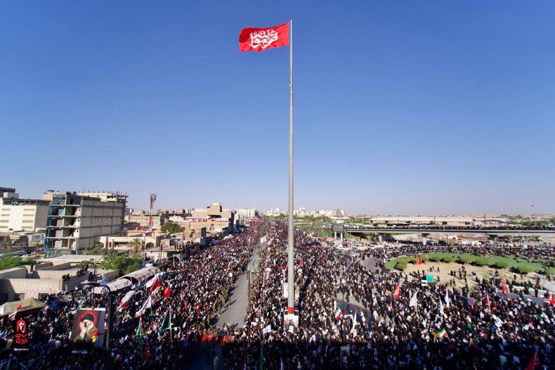 Large Presence of Mourning Iraqi People in Al-Thawra Al-Ishreen Square, Najaf for Funeral Procession and Hoisting of 'Qomoo Lillah' Flag